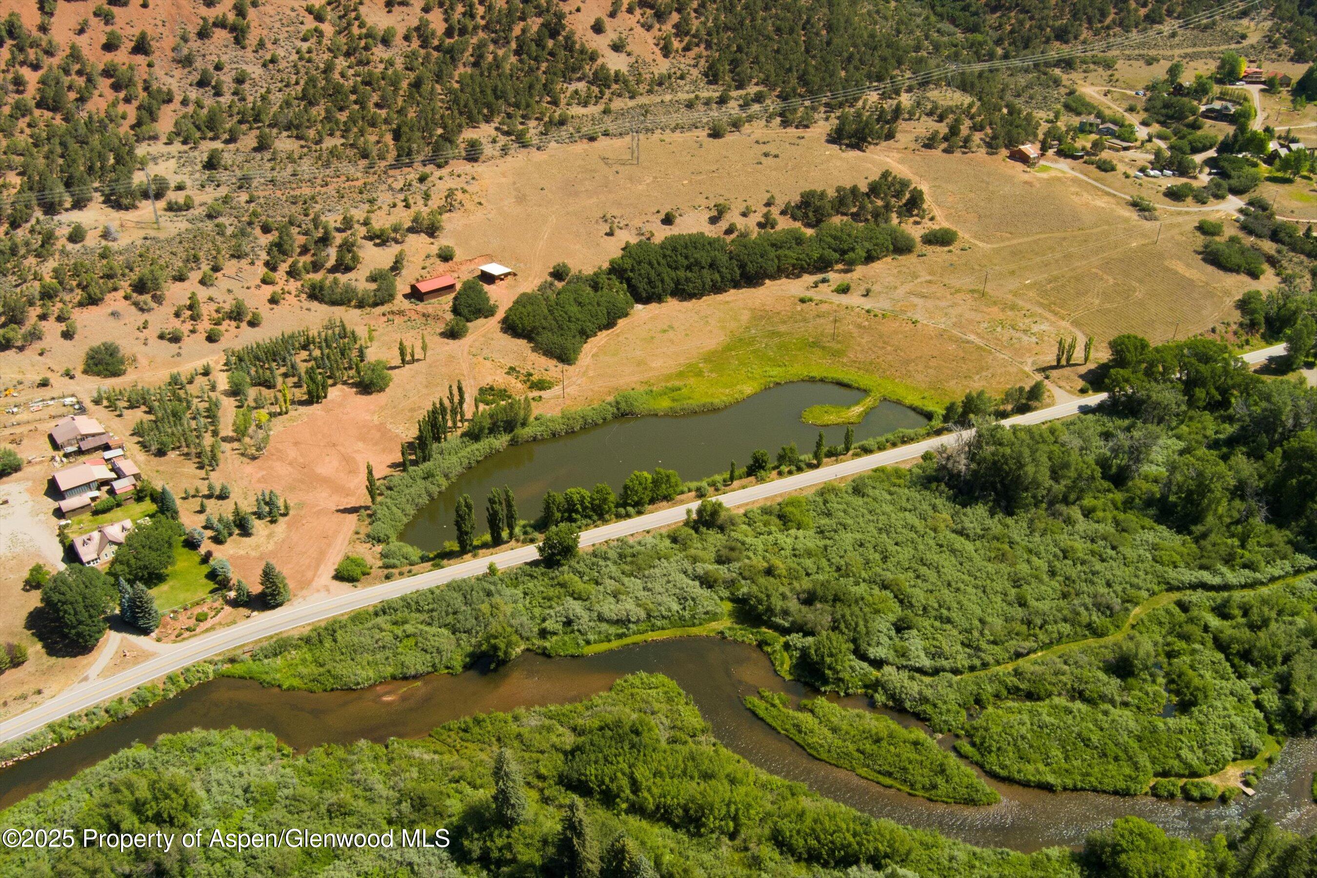 5045 Frying Pan Road Basalt, CO 81621 - Photo 13 of 22 a view of a lake with a yard