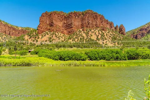 a view of an ocean with a mountain
