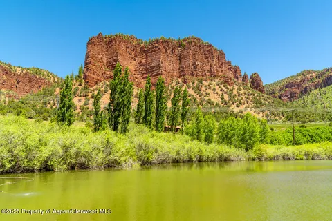 a view of an ocean with a building in the background