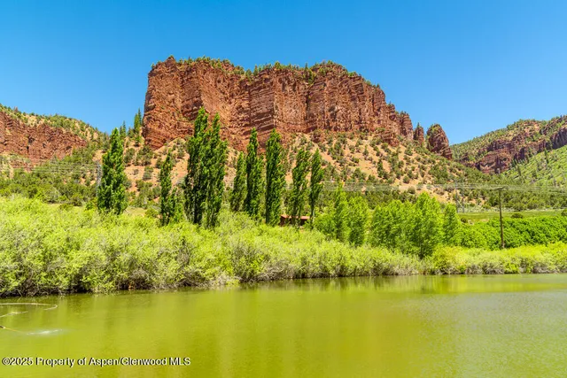 a view of an ocean with a building in the background