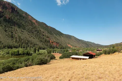 a view of a road with a yard