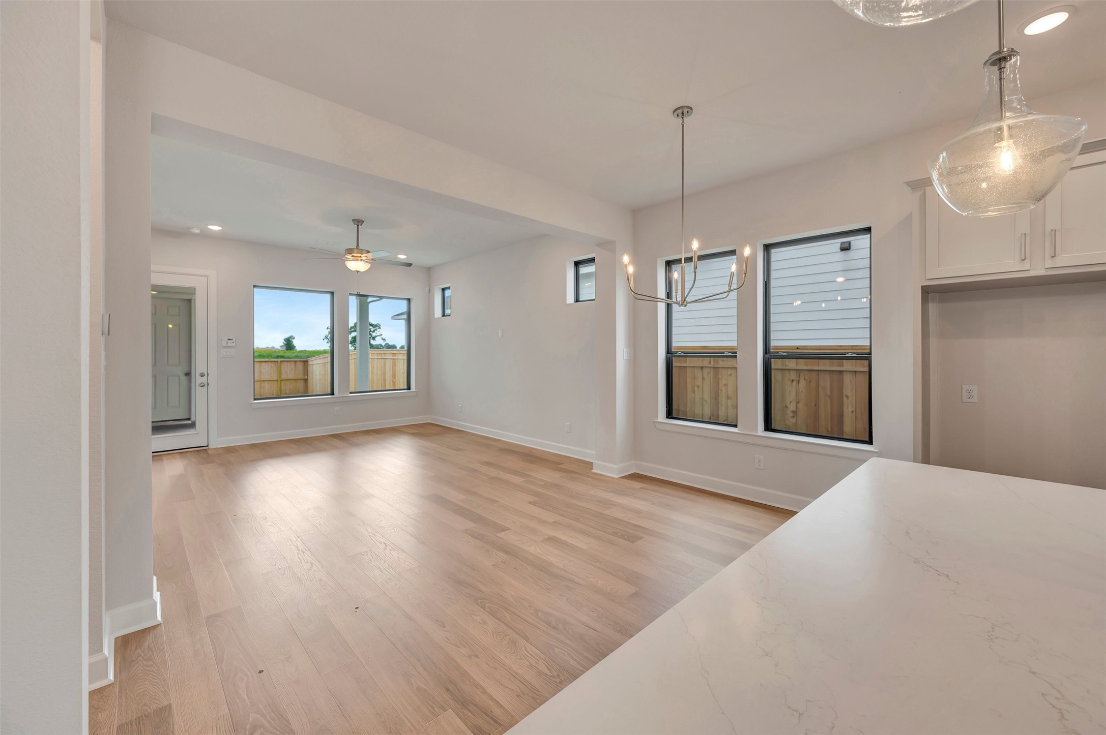 2718 Cottage Place Rosharon, TX 77583 - Photo 24 of 50 a view of an empty room with window and wooden floor