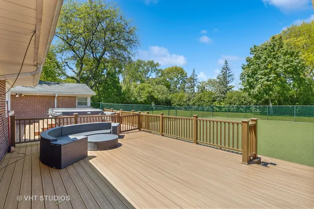 a view of balcony with deck and wooden floor