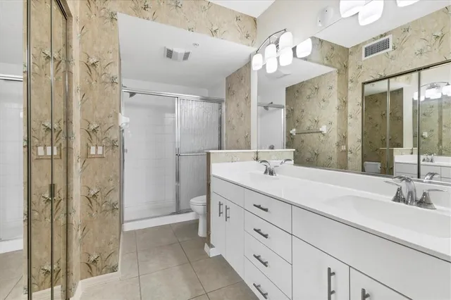 a view of a garden with a building in the background