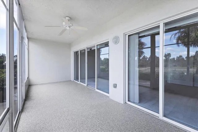 a view of a lake with a big yard and large trees