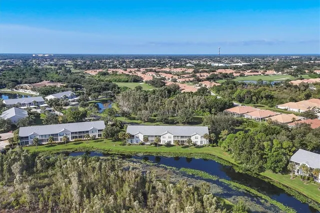 a aerial view of a house with garden space and street view