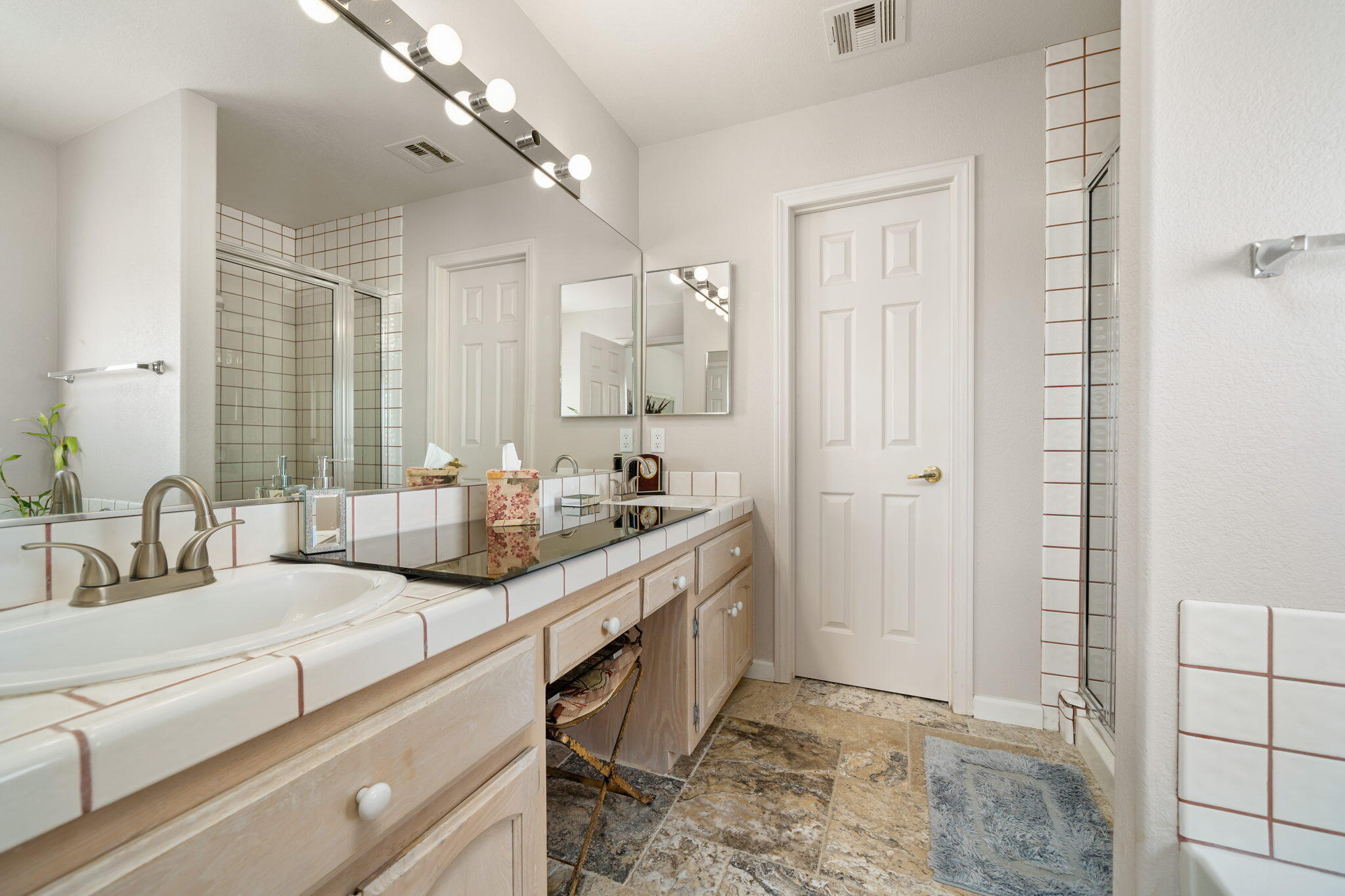 71750 Cholla Way Palm Desert, CA 92260 - Photo 30 of 42 a bathroom with a granite countertop sink and a mirror