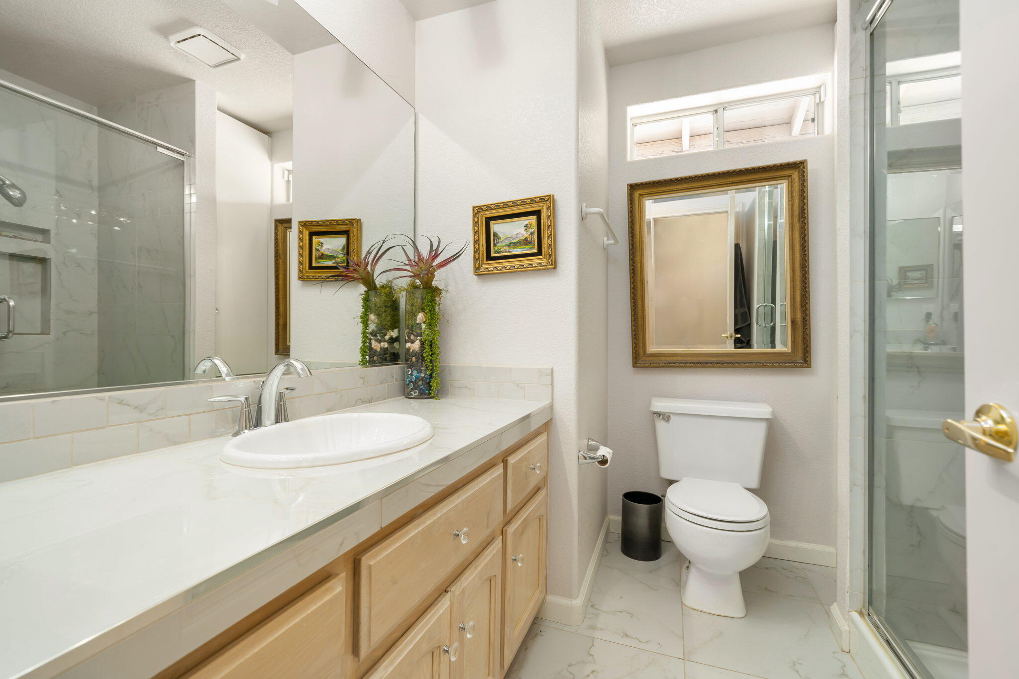 71750 Cholla Way Palm Desert, CA 92260 - Photo 31 of 42 a bathroom with a granite countertop toilet sink and mirror