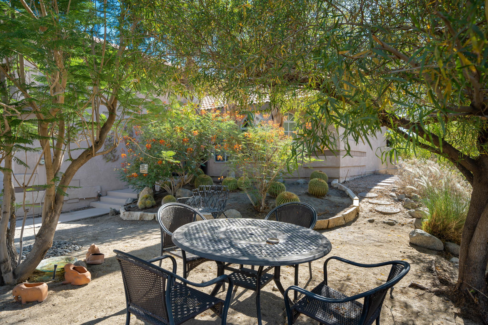 71750 Cholla Way Palm Desert, CA 92260 - Photo 42 of 42 a backyard of a house with table and chairs