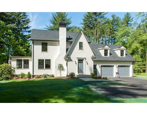 909 Lowell Road Concord, MA 01742 - Photo 1 of 28 a front view of a house with a yard