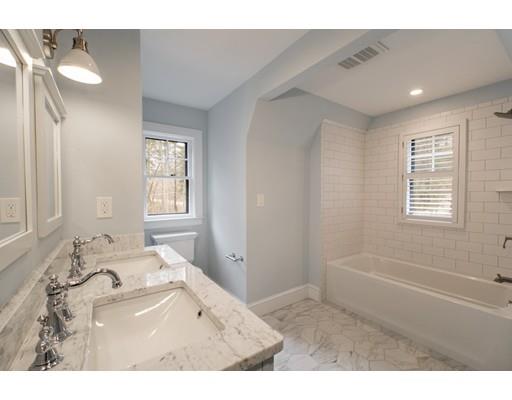 909 Lowell Road Concord, MA 01742 - Photo 24 of 28 a bathroom with a tub sink and a mirror