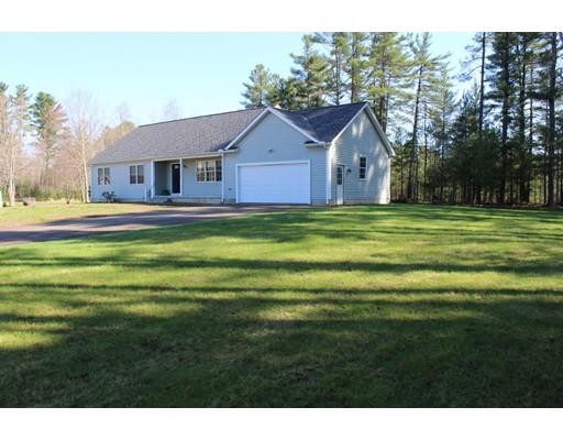 157 Old Coldbrook Road Barre, MA 01005 - Photo 2 of 21 a front view of a house with a yard and trees