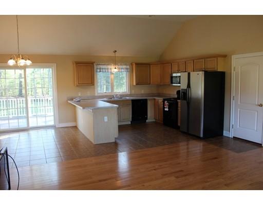 157 Old Coldbrook Road Barre, MA 01005 - Photo 6 of 21 a open kitchen with kitchen island wooden floors and stainless steel appliances