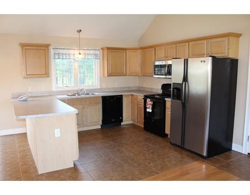 157 Old Coldbrook Road Barre, MA 01005 - Photo 7 of 21 a kitchen with stainless steel appliances granite countertop a refrigerator a sink a stove and island