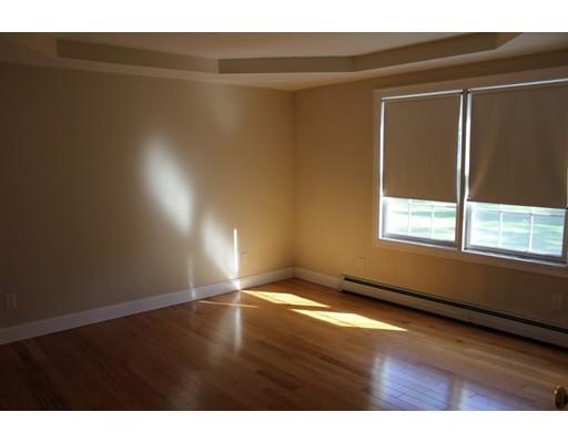 157 Old Coldbrook Road Barre, MA 01005 - Photo 9 of 21 a view of an empty room with wooden floor and a window