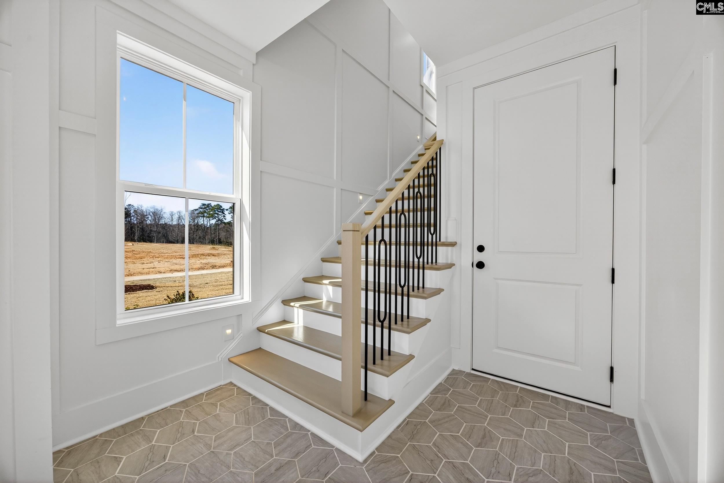 1318 Long Grove Way Lexington, SC 29072 - Photo 71 of 90 a view of entryway with wooden floor and stairs