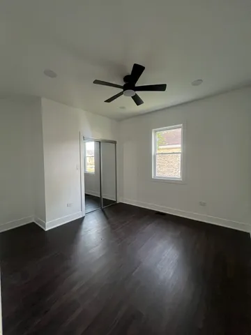 a bathroom with a double vanity sink toilet and shower