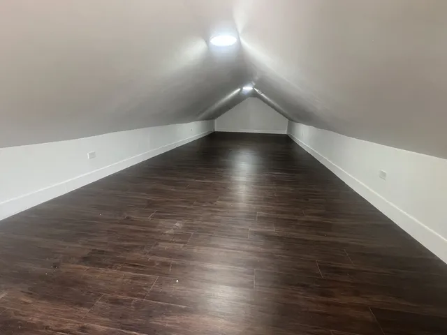 a bathroom with a granite countertop sink toilet and bathtub