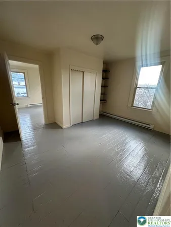 a view of an empty room and window