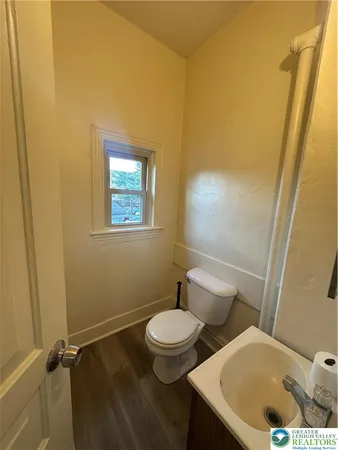 a bathroom with a toilet and sink