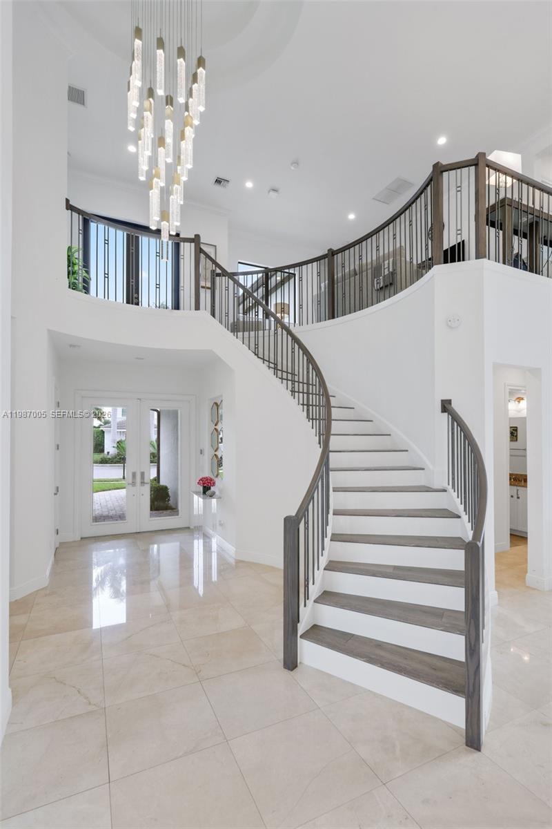 2751 Northwest 70th Boulevard Boca Raton, FL 33496 - Photo 19 of 90 a view of entryway and hall with a front door