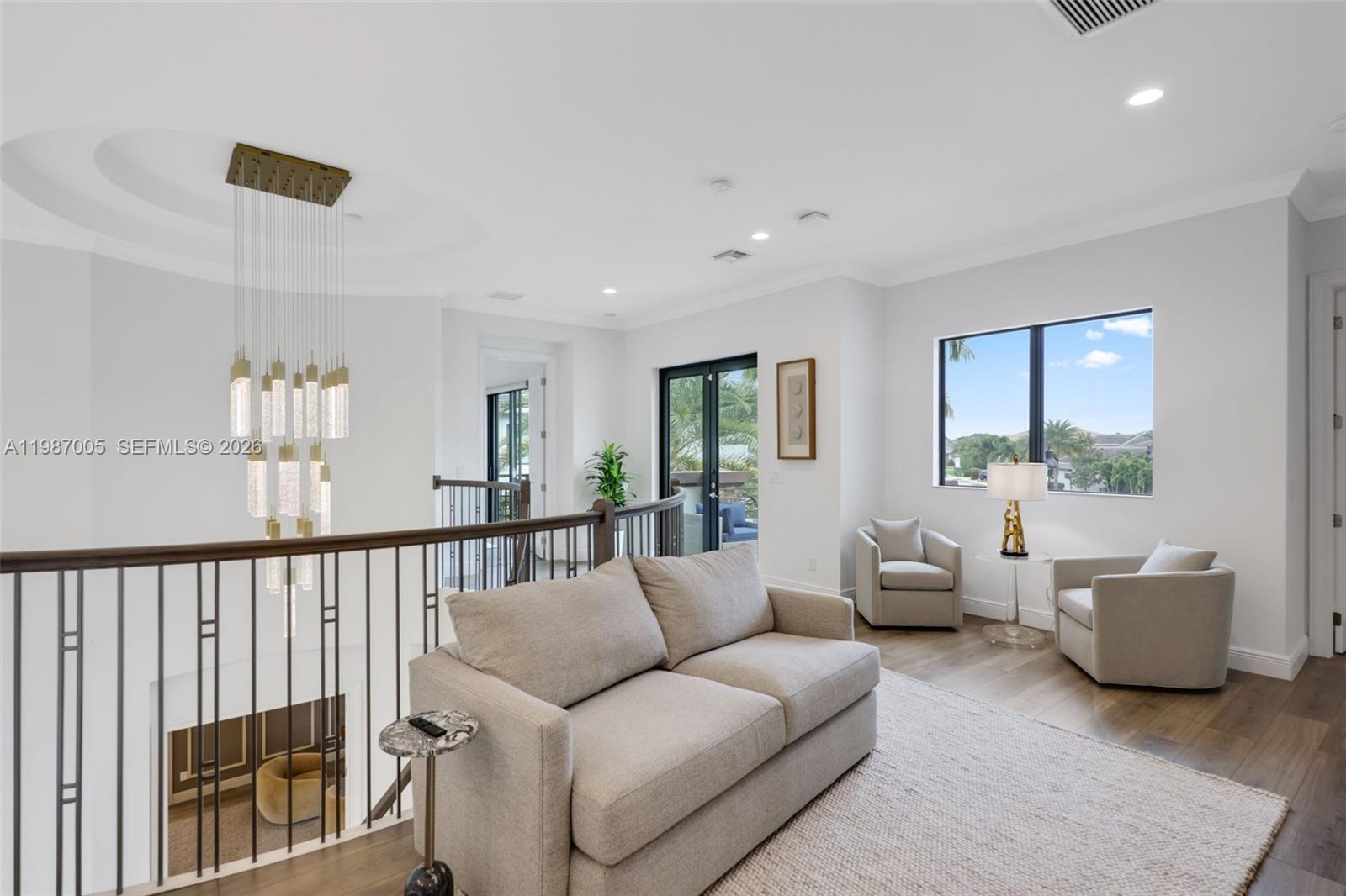 2751 Northwest 70th Boulevard Boca Raton, FL 33496 - Photo 21 of 90 a living room with furniture and a large window