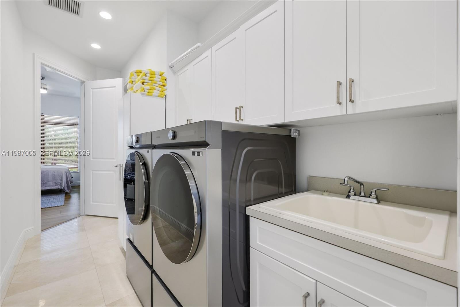 2751 Northwest 70th Boulevard Boca Raton, FL 33496 - Photo 46 of 90 a utility room with dryer and washer
