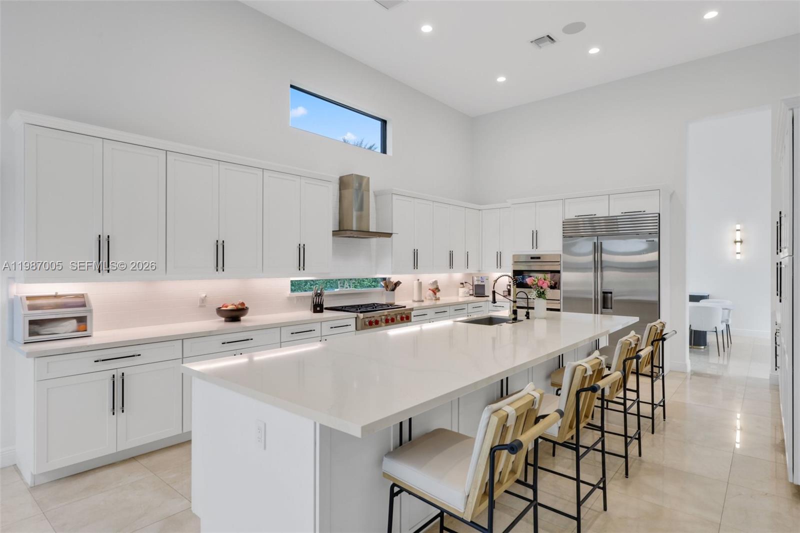 2751 Northwest 70th Boulevard Boca Raton, FL 33496 - Photo 52 of 90 a kitchen with appliances a sink a counter top space and cabinets