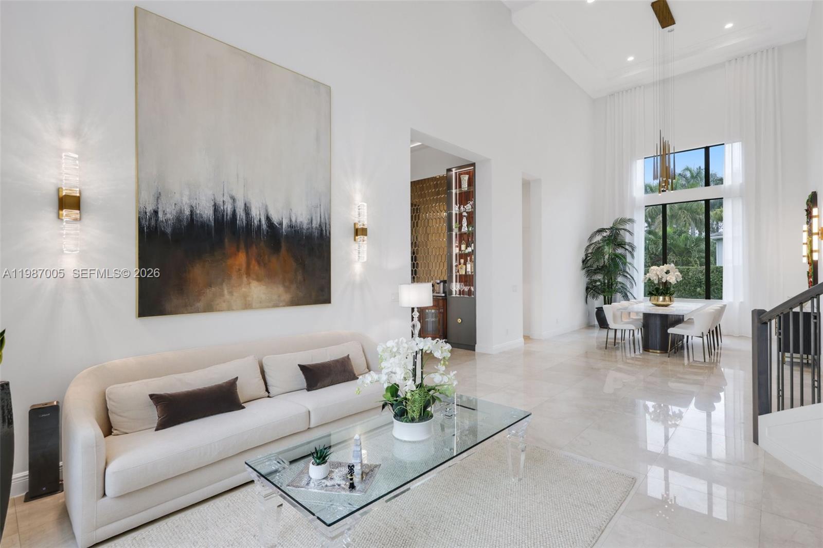 2751 Northwest 70th Boulevard Boca Raton, FL 33496 - Photo 59 of 90 a living room with furniture and a large window