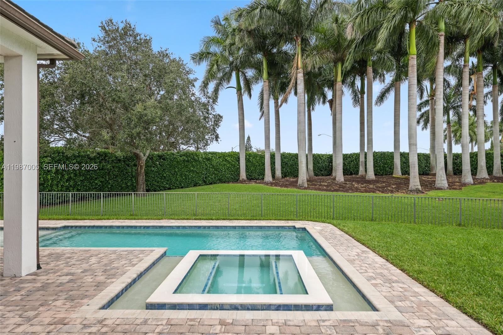 2751 Northwest 70th Boulevard Boca Raton, FL 33496 - Photo 67 of 90 a view of yard with swimming pool and green space
