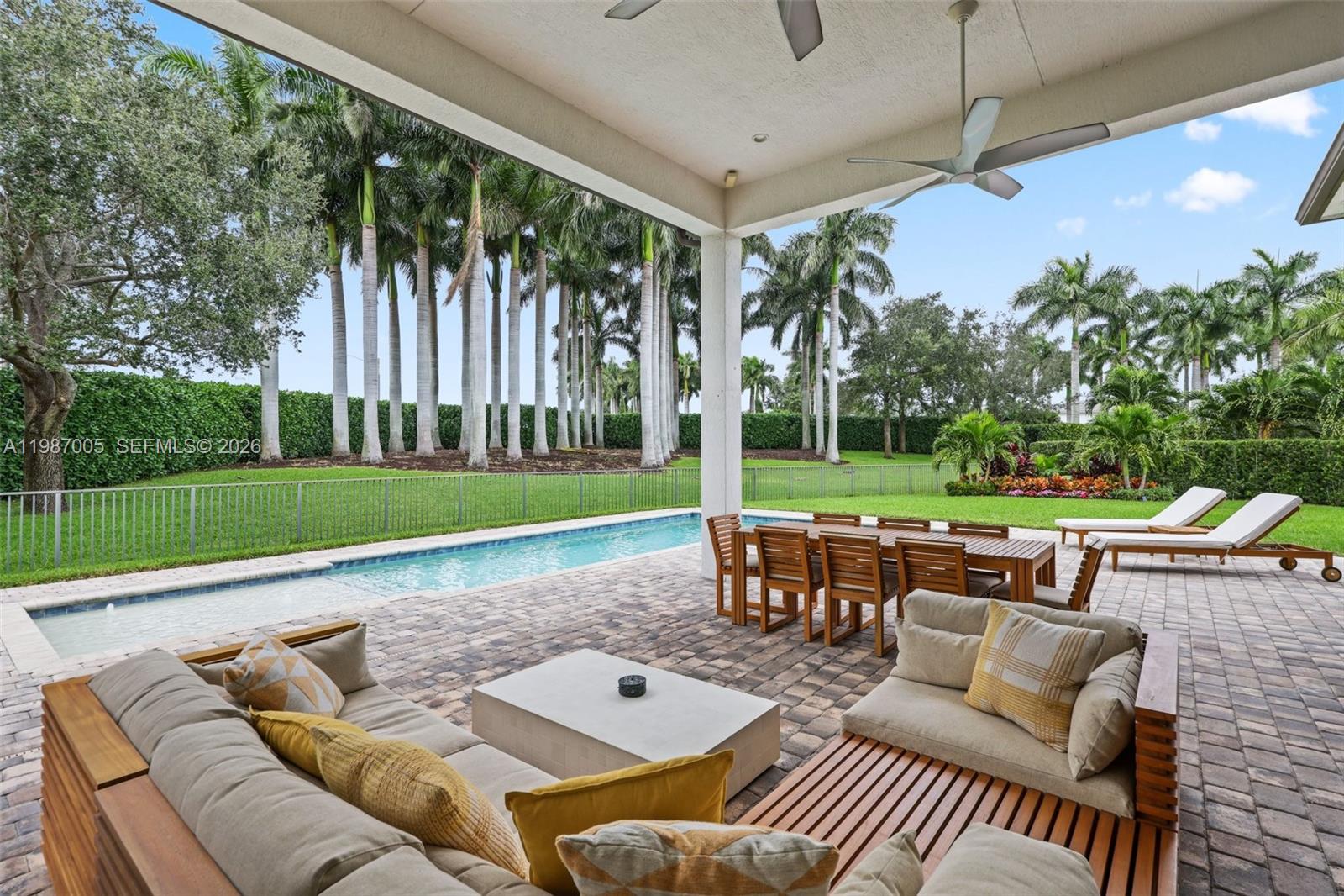 2751 Northwest 70th Boulevard Boca Raton, FL 33496 - Photo 70 of 90 a view of a patio with couches and table