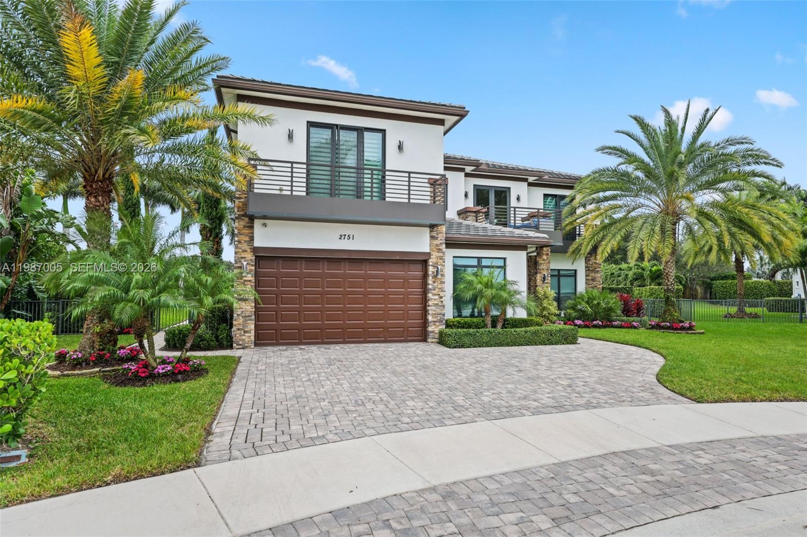 2751 Northwest 70th Boulevard Boca Raton, FL 33496 - Photo 88 of 90 a front view of house with yard and green space