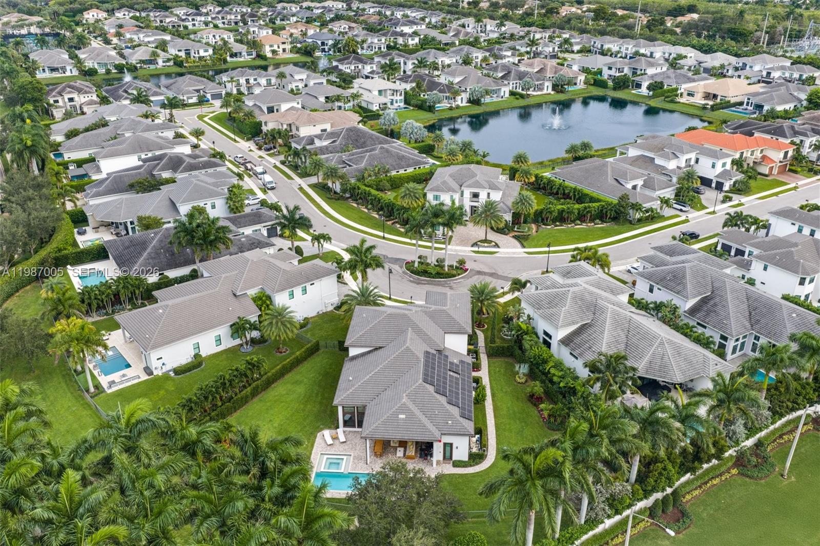 2751 Northwest 70th Boulevard Boca Raton, FL 33496 - Photo 90 of 90 an aerial view of residential houses with outdoor space and lake view