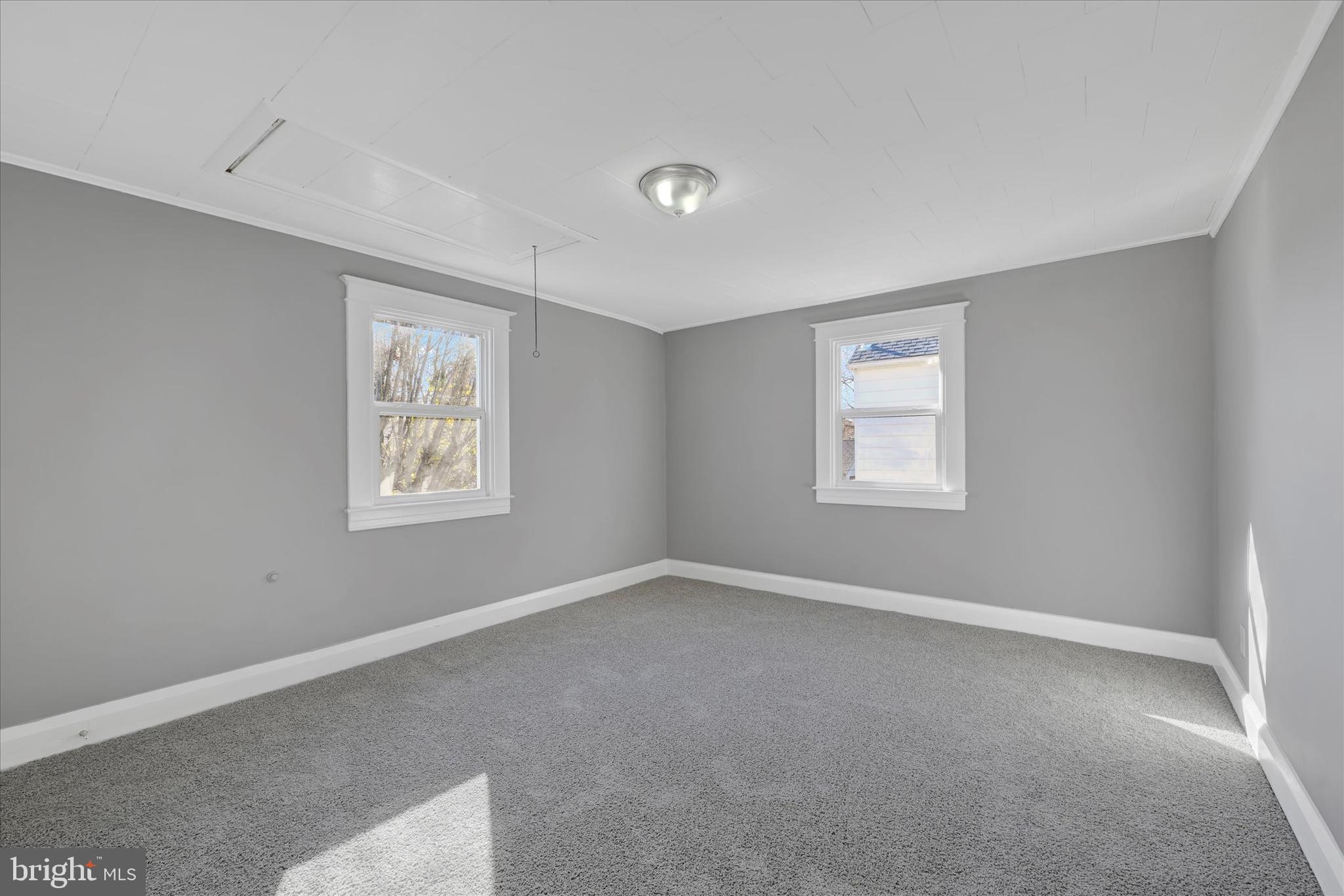 6113 Sefton Avenue Baltimore, MD 21214 - Photo 14 of 25 an empty room with windows