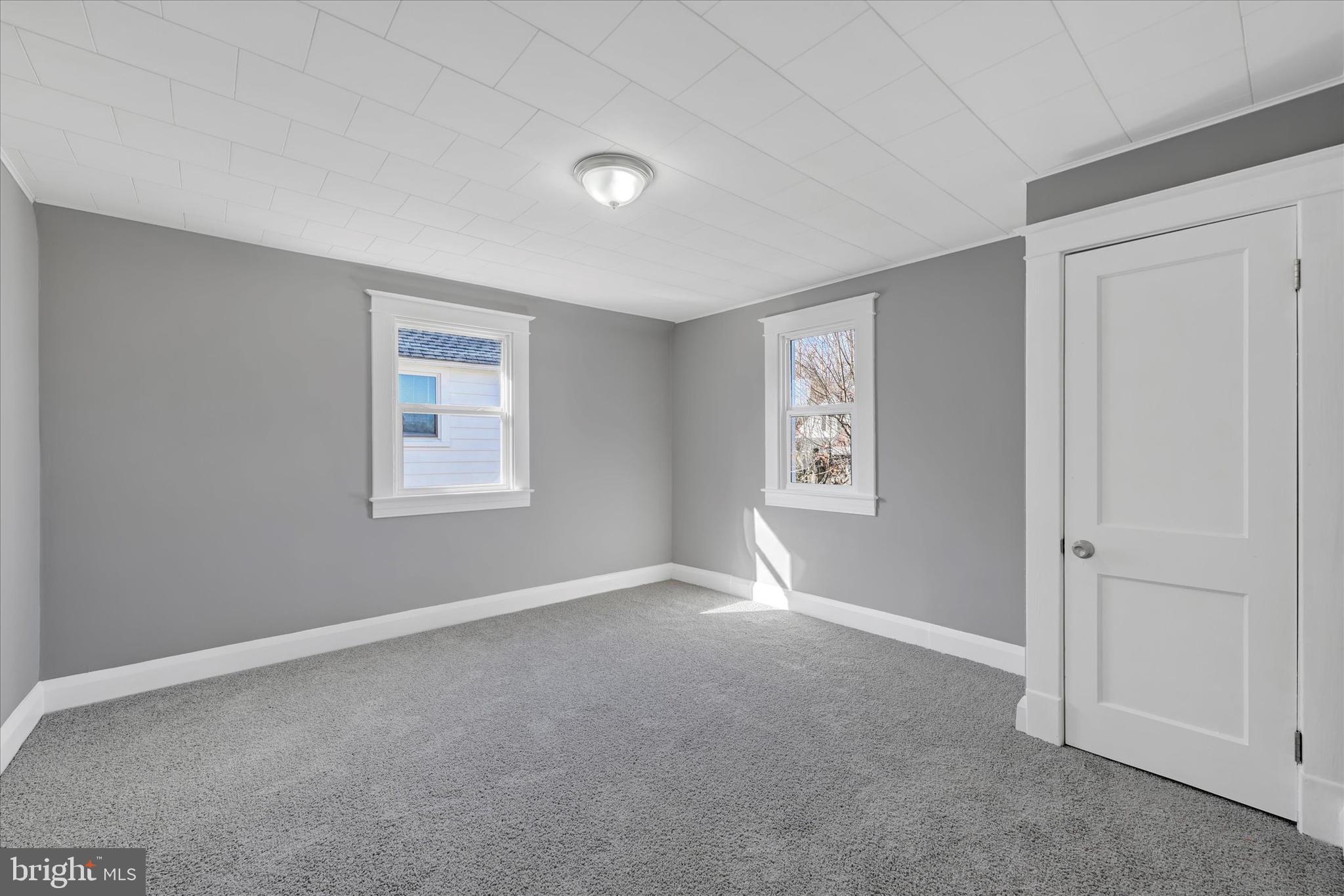 6113 Sefton Avenue Baltimore, MD 21214 - Photo 17 of 25 a view of an empty room with a window