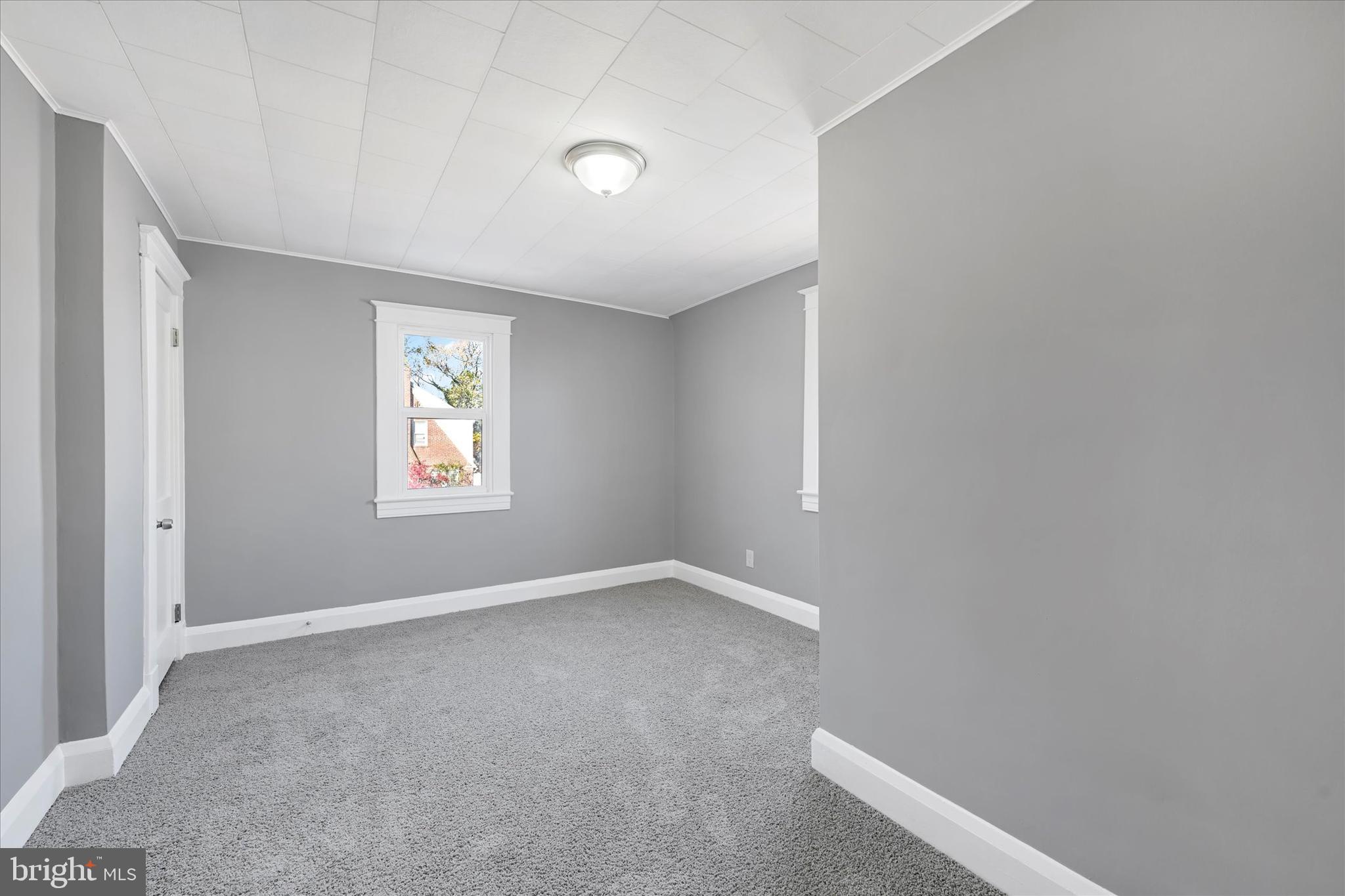 6113 Sefton Avenue Baltimore, MD 21214 - Photo 18 of 25 an empty room with windows