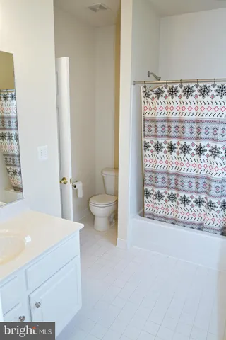 a bathroom with a toilet sink and shower