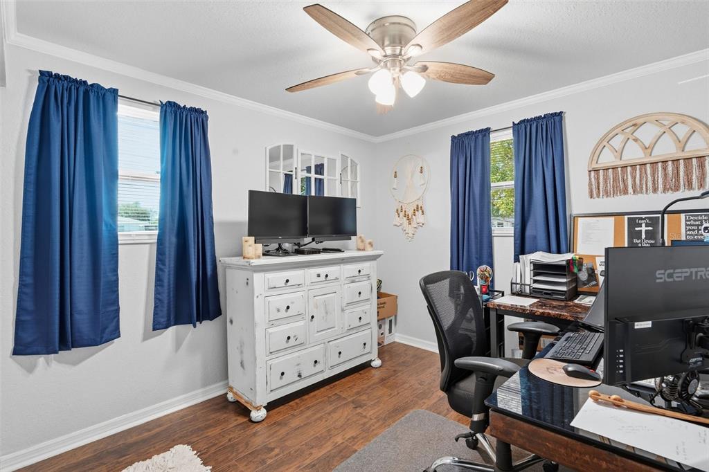 9381 Rosa Street Spring Hill, FL 34608 - Photo 12 of 26 a view of a workspace with furniture and a window