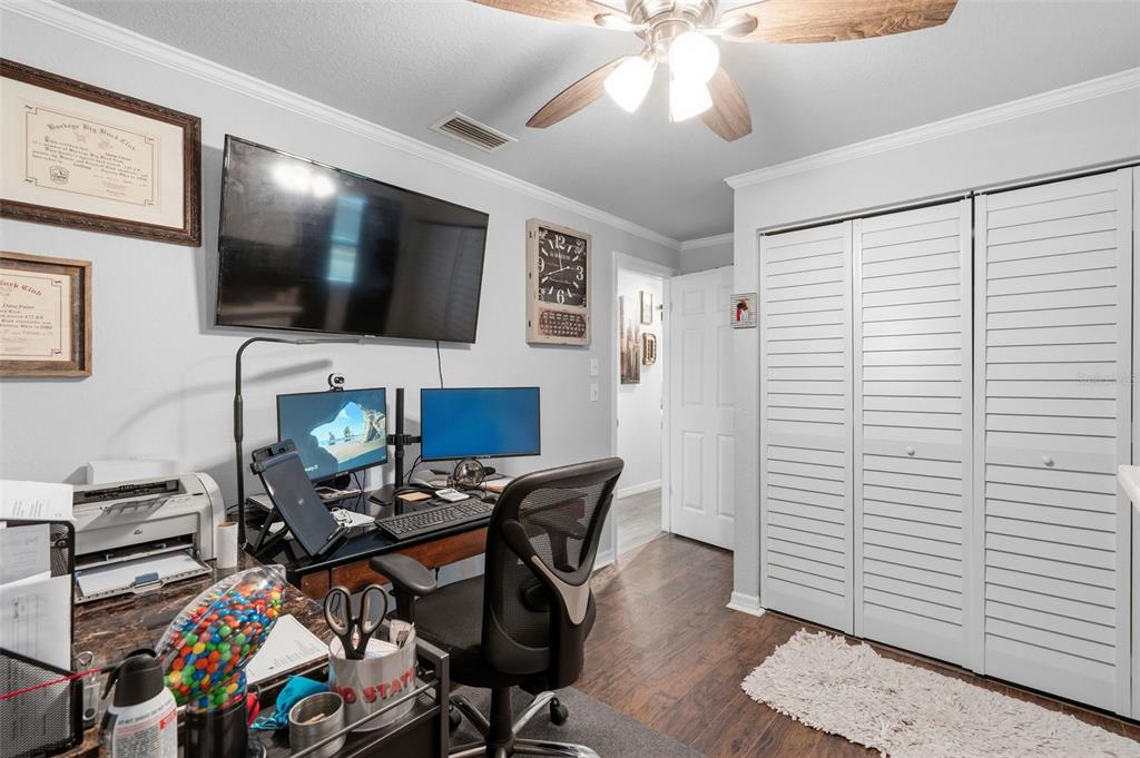 9381 Rosa Street Spring Hill, FL 34608 - Photo 13 of 26 a view of a livingroom with workspace and a window