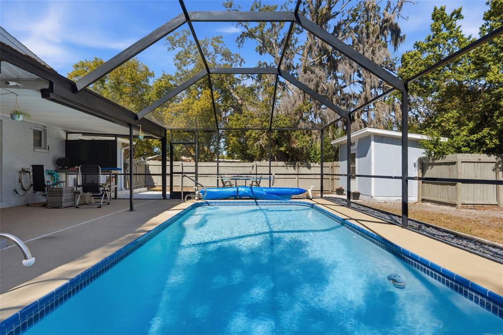 9381 Rosa Street Spring Hill, FL 34608 - Photo 15 of 26 a view of a swimming pool with a slide