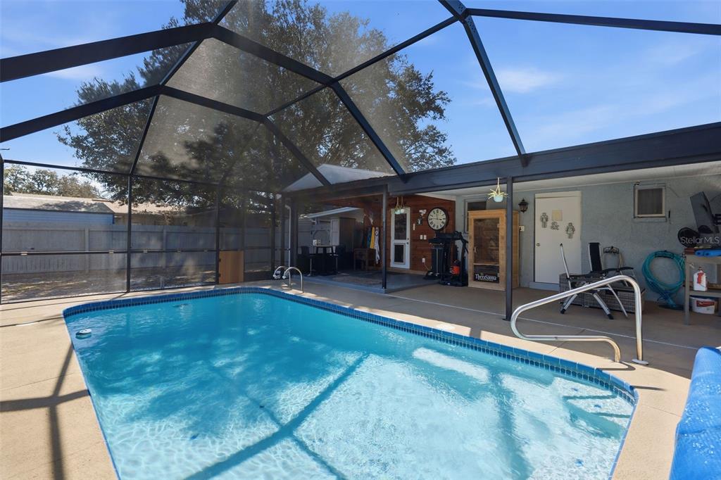 9381 Rosa Street Spring Hill, FL 34608 - Photo 16 of 26 a view of a room with gym equipment