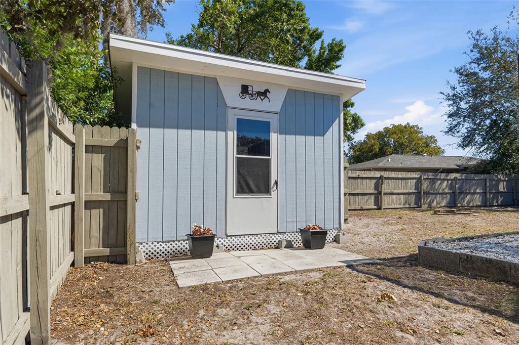 9381 Rosa Street Spring Hill, FL 34608 - Photo 19 of 26 a front view of a house with a yard