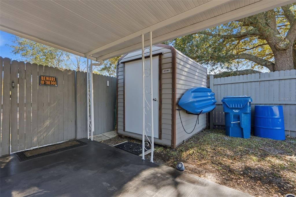 9381 Rosa Street Spring Hill, FL 34608 - Photo 21 of 26 a view of a small barn with a table and chairs