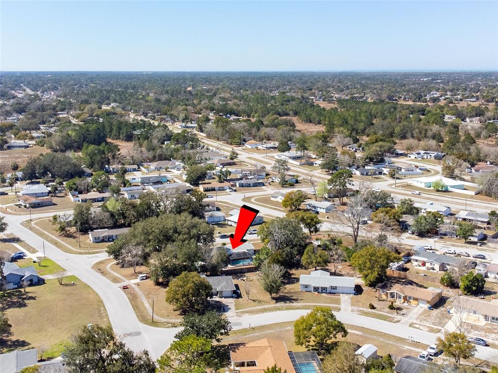 9381 Rosa Street Spring Hill, FL 34608 - Photo 23 of 26 an aerial view of residential houses with outdoor space