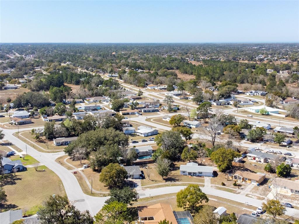 9381 Rosa Street Spring Hill, FL 34608 - Photo 24 of 26 an aerial view of residential houses with outdoor space