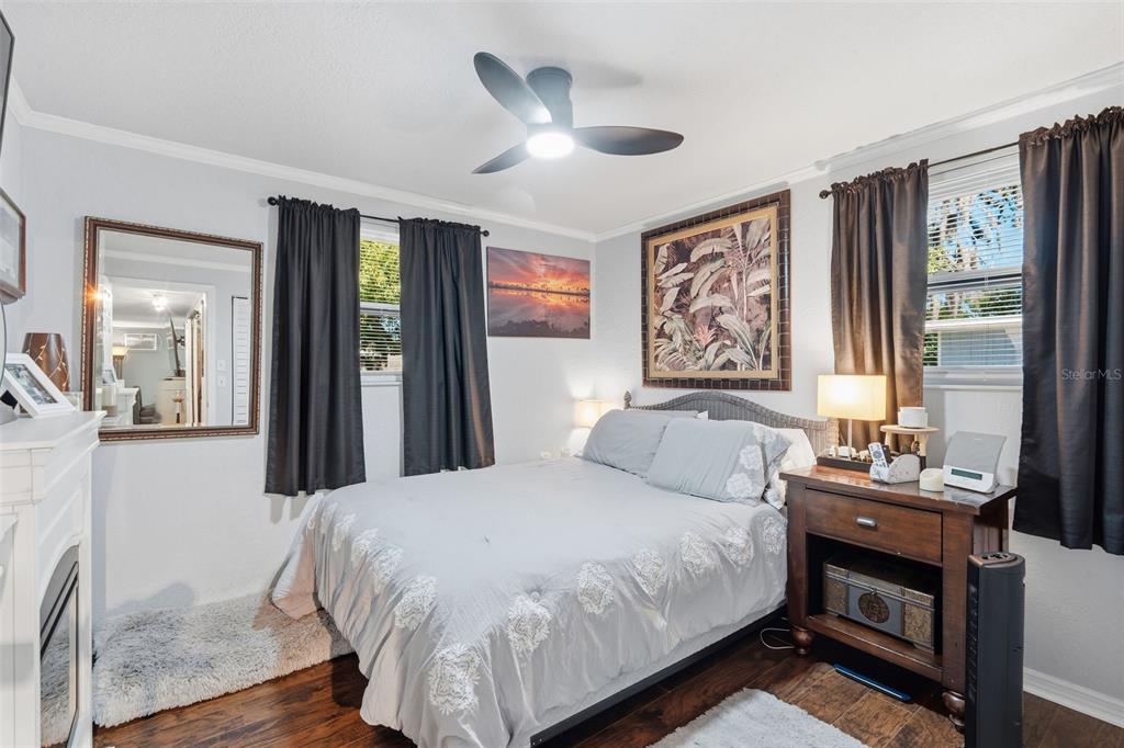 9381 Rosa Street Spring Hill, FL 34608 - Photo 9 of 26 a bedroom with a large bed and a large window