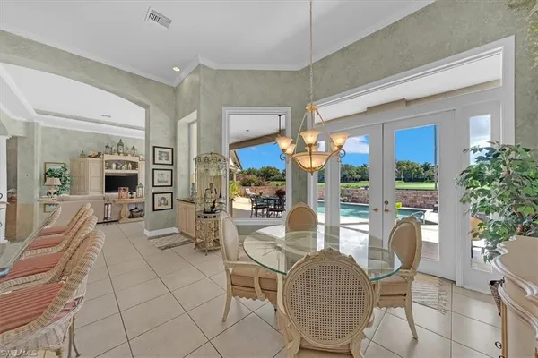a view of a patio with a dining table and chairs with a yard