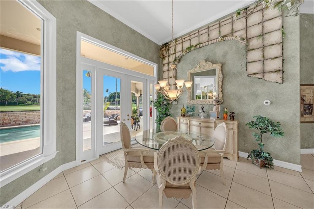 2339 Alexander Palm Naples, FL 34105 - Photo 12 of 45 a view of a dining room with furniture window and outside view