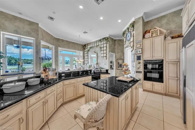 a kitchen with stainless steel appliances granite countertop a sink and cabinets