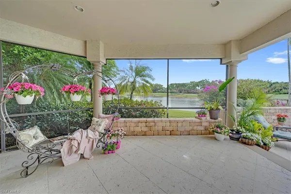 a view of house with swimming pool outdoor seating